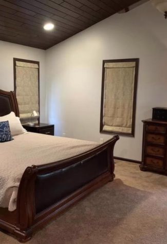 King size bed and dresser in one of the bedrooms