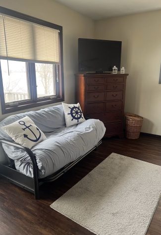 one of the futons in one of the bedrooms with a nautical theme