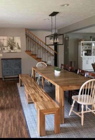 A view of the dining area off the kitchen which looks to accommodate 10-12 people at the table
